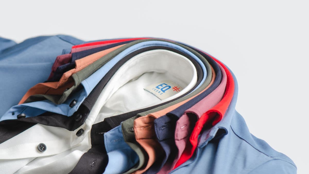 A fanned stack of neatly folded men's shirts